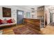 The foyer features unique wood wall paneling and a stylish rug that welcomes you into the home at 5408 E Briarwood Cir, Centennial, CO 80122