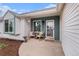 Inviting front porch with rocking chairs and a view of the neighborhood from this lovely home at 5408 E Briarwood Cir, Centennial, CO 80122