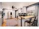 Bright kitchen with stainless steel appliances, tile backsplash, and a convenient breakfast bar for casual dining at 5408 E Briarwood Cir, Centennial, CO 80122