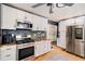 Well-equipped kitchen with stainless steel appliances, granite countertops, and ample cabinet space for storage at 5408 E Briarwood Cir, Centennial, CO 80122