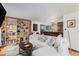 Bright living room with a comfortable sectional sofa and a custom bookshelf, offering a welcoming space at 5408 E Briarwood Cir, Centennial, CO 80122