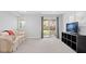 Finished basement with walkout to backyard, sofa, and entertainment center at 2545 Andrew Dr, Superior, CO 80027