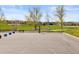 Outdoor basketball court featuring a full-sized court, bench seating, and green space at 2545 Andrew Dr, Superior, CO 80027