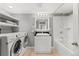 Bathroom with vanity, shower-tub, and washer-dryer at 2545 Andrew Dr, Superior, CO 80027