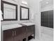 Well-lit bathroom with dual sinks and modern tile backsplash at 2545 Andrew Dr, Superior, CO 80027