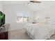 Bright bedroom with ceiling fan and large window at 2545 Andrew Dr, Superior, CO 80027