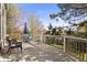 Outdoor deck with furniture, a wooden railing, and sunny view at 2545 Andrew Dr, Superior, CO 80027