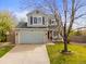 Charming home with a well-maintained lawn, two car garage, and inviting front porch at 2545 Andrew Dr, Superior, CO 80027