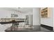 Modern kitchen with stainless steel appliances, backsplash, and open layout at 2545 Andrew Dr, Superior, CO 80027