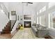 Bright living room with a fireplace, large windows, and elegant decor creating a cozy and inviting space at 2545 Andrew Dr, Superior, CO 80027