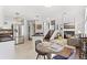 Open floor plan with cozy fireplace, dining area and kitchen view at 2545 Andrew Dr, Superior, CO 80027