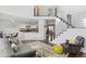 Open-concept living room featuring a modern staircase and seamless flow into the kitchen at 2545 Andrew Dr, Superior, CO 80027