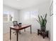 Bright office with wooden desk, chair, and sun-lit window at 2545 Andrew Dr, Superior, CO 80027