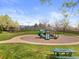 Community playground area featuring a slide and climbing structure, picnic table, and tennis court at 2545 Andrew Dr, Superior, CO 80027