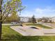 Neighborhood skatepark featuring various ramps and rails, surrounded by green space and residential streets at 2545 Andrew Dr, Superior, CO 80027