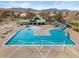 Community pool and clubhouse with a large pool, splash umbrella, and mountain views at 2545 Andrew Dr, Superior, CO 80027