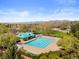 Community pool with a clear blue swimming pool, clubhouse, and mountain views in the background at 2545 Andrew Dr, Superior, CO 80027