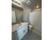 Chic bathroom features modern vanity with marble countertop, stylish patterned floors, and a shower at 1353 Reynolds St # 5A, Fort Lupton, CO 80621