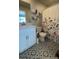 Bright, updated bathroom features a modern vanity, unique patterned floors, and a shower at 1353 Reynolds St # 5A, Fort Lupton, CO 80621