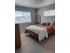 Cozy bedroom featuring dual windows with ample natural light and neutral décor at 1353 Reynolds St # 5A, Fort Lupton, CO 80621