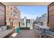Balcony with furniture and a view of the city at 1449 Wynkoop St # 601, Denver, CO 80202