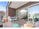 Outdoor patio with comfortable seating, city views, and sliding door access at 1449 Wynkoop St # 601, Denver, CO 80202