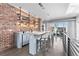 Stylish bar area with brick wall, modern shelving, and ample counter space at 1449 Wynkoop St # 601, Denver, CO 80202