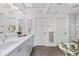 Elegant bathroom featuring dual sinks, a soaking tub, and a glass-enclosed shower at 1449 Wynkoop St # 601, Denver, CO 80202