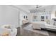 Cozy bedroom featuring an accent chair, city view windows and sleek decor at 1449 Wynkoop St # 601, Denver, CO 80202
