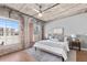 Bright bedroom with exposed brick, large windows, and comfortable bedding at 1449 Wynkoop St # 601, Denver, CO 80202