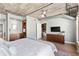 Bedroom with wood floors, exposed pipes, and soft, neutral colors at 1449 Wynkoop St # 601, Denver, CO 80202