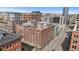 Aerial view of a brick building in a city setting, showcasing its architecture and surroundings at 1449 Wynkoop St # 601, Denver, CO 80202