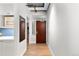 Hallway with modern design, built-in shelving, and a view into another room at 1449 Wynkoop St # 601, Denver, CO 80202