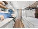 Bright kitchen featuring an island, stainless appliances, and blue backsplash at 1449 Wynkoop St # 601, Denver, CO 80202