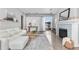 Bright living room featuring a modern fireplace, plush seating, and a stylish rug at 1449 Wynkoop St # 601, Denver, CO 80202