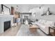 Spacious living room with fireplace, modern decor, and access to balcony with city views at 1449 Wynkoop St # 601, Denver, CO 80202