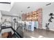 Stylish living area with a bar, exposed brick wall, and modern design elements at 1449 Wynkoop St # 601, Denver, CO 80202