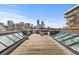 City skyline view from a spacious rooftop deck with skylights and outdoor seating area at 1449 Wynkoop St # 601, Denver, CO 80202