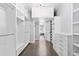 Spacious walk-in closet with custom shelving, drawers, and ample hanging space at 1449 Wynkoop St # 601, Denver, CO 80202