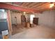 Unfinished basement with utilities and concrete walls and floors at 2685 W Asbury Ave, Denver, CO 80219