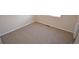 A bedroom features a neutral carpet, white walls, and a window providing natural light at 2685 W Asbury Ave, Denver, CO 80219