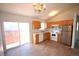 Bright eat-in kitchen area features modern appliances and a view to the patio at 2685 W Asbury Ave, Denver, CO 80219