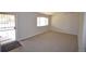 Bright living room featuring new carpet and ample natural light at 2685 W Asbury Ave, Denver, CO 80219