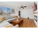 Bright living room with hardwood floors, fireplace, comfortable seating, and modern decor at 2930 Oneida St, Denver, CO 80207