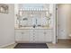 Bright bathroom featuring dual sinks, ample counter space, vanity mirror, and stylish fixtures at 6850 Xavier Cir # 5, Westminster, CO 80030