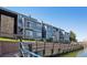 Exterior view showing the building's lakeside location and balconies at 6850 Xavier Cir # 5, Westminster, CO 80030