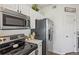 Well-equipped kitchen with stainless steel appliances and adjacent to a dining area at 6850 Xavier Cir # 5, Westminster, CO 80030