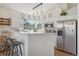 Modern kitchen with stainless steel appliances, breakfast bar, and ample natural light at 6850 Xavier Cir # 5, Westminster, CO 80030