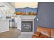 Living room with fireplace, adjacent to the modern kitchen with stainless steel appliances at 6850 Xavier Cir # 5, Westminster, CO 80030