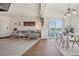 Cozy living room and dining area with modern furnishings and water view from the balcony at 6850 Xavier Cir # 5, Westminster, CO 80030